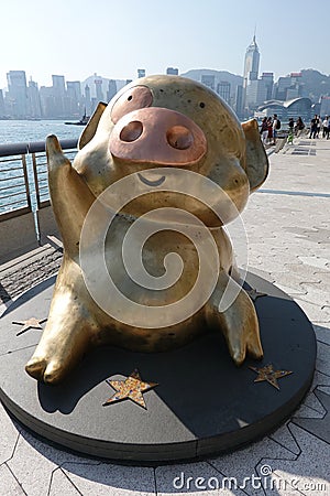 A bronze sculpture of McDull, an anthropomorphic pig cartoon character, was installed on Hong Kong`s Avenue of Stars Editorial Stock Photo