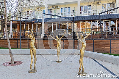 Bronze sculptures of three dancing girls. Editorial Stock Photo