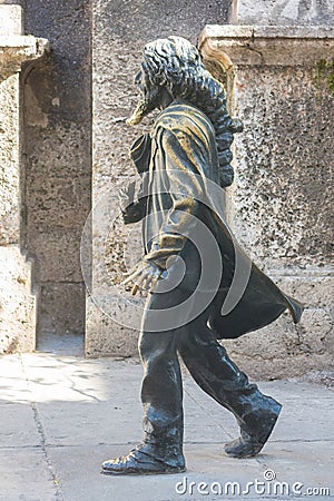 A bronze statue of the beloved Caballero de Paris stands in front of the church of San Francisco de Asis in Habana Vieja; Old Editorial Stock Photo