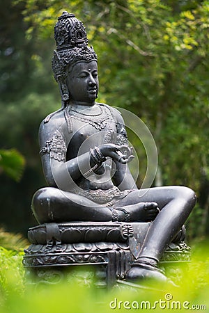 Bronze statue Bodhisattva in the garden Stock Photo
