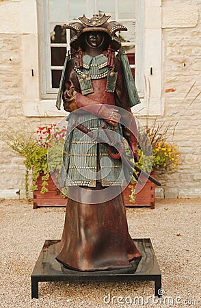 Bronze statue in the front of Chateau de Pommard w Editorial Stock Photo