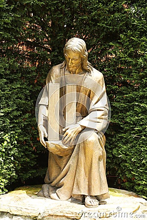 Bronze statue of Jesus Christ holding World Trade Center buildings Editorial Stock Photo