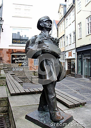 Bronze statue the Porter, represents Christian Werner, town's last luggage carrier, Marburg, Hesse, Germany Editorial Stock Photo