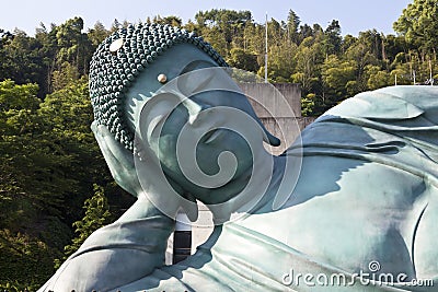 The bronze statue of reclining Buddha state at Nanzoin Temple in Sasaguri, Fukuoka, Japan.This is the bigest lying statue in the Stock Photo