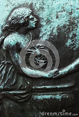 Bronze statue relief emboss detail girl holding hand Stock Photo