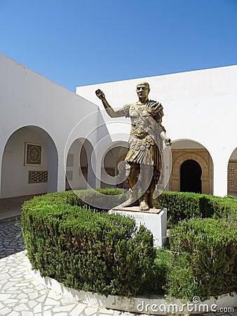 Bronze statue of the roman emperor Trajan at the entrance to the Editorial Stock Photo