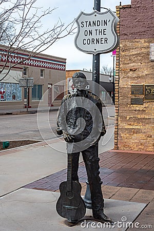 Bronze statue by Ron Adamson, forming a part of Standin` On The Corner Park in Winslow, AZ Editorial Stock Photo