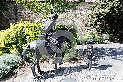 Glastonbury Abbey, Somerset England. Bronze statue at entrance. Editorial Stock Photo