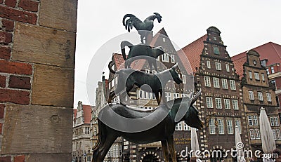 Bronze statue of the Town Musicians of Bremen in old city centre, beautiful houses on the background, Bremen, Germany Editorial Stock Photo