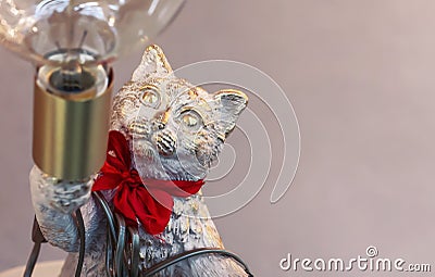 Bronze statuette of a cat with a lamp Stock Photo