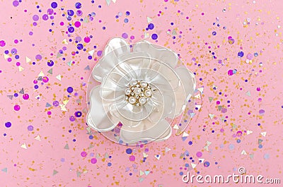 Brooch flower with pearls in spangles isolated on pink background Stock Photo