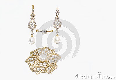 Brooch, ring and earrings with diamonds and pearls Stock Photo