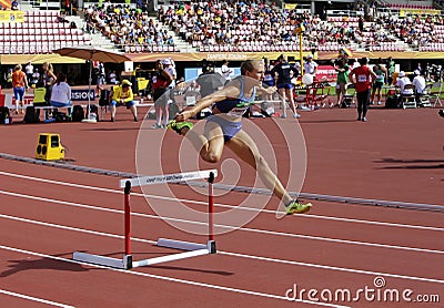 Brooke JAWORSKI running 400 meters hurdles on the IAAF World U20 Championship in Tampere, Finland 11 July, 2018. Editorial Stock Photo