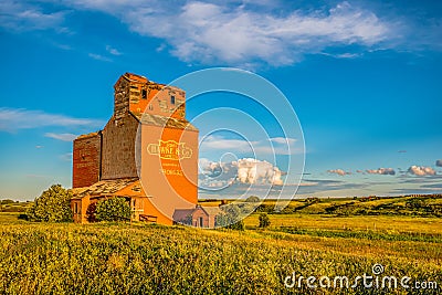 Brooking, SK- July 18, 2020: Sunset over the abandoned grain elevator in the ghost town of Brooking, SK Editorial Stock Photo