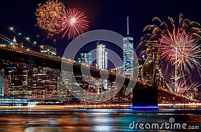 Brooklyn Bridge at dusk in New York City Colorful and vibrant fireworks Editorial Stock Photo