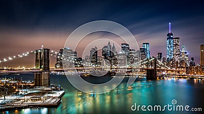 Brooklyn Bridge and the Financial District by night Editorial Stock Photo