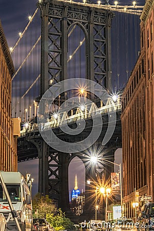 Brooklyn, New York - November 16, 2018 : View of the Empire State Building through the Manhattan bridge Editorial Stock Photo