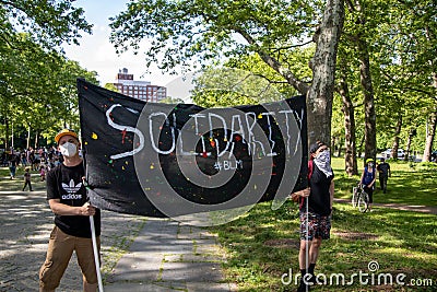 Peaceful protest at Grand army Plaza. Protesters holding signs Editorial Stock Photo