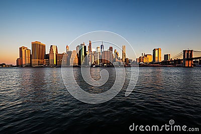 Horizontal panoramic sunrise view of Manhattanâ€™s financial district seen across the East Editorial Stock Photo