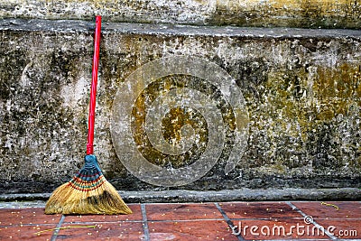 Broomstick towards wall Stock Photo