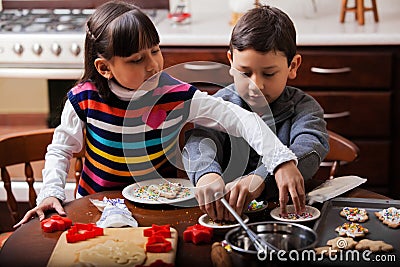 Brother and sister baking cookies Stock Photo