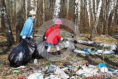 Brother and sister collect trash in park Stock Photo