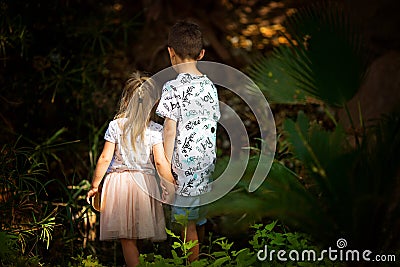 Brother and sister in a fairy forest Stock Photo