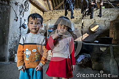 Brother and sister inside their rural home at kitchen area Editorial Stock Photo