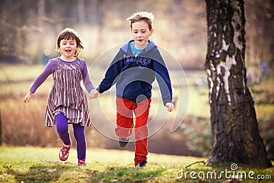 Brother and sister running Stock Photo