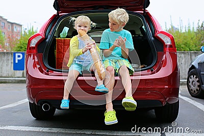 Brother and sister sitting in family car Stock Photo