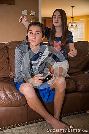 Brother and Sister - Sneak attack Stock Photo