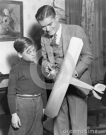 Brothers with model airplane Stock Photo