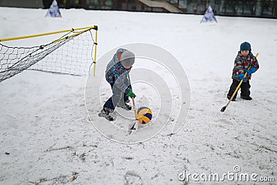 Brothers play bandy Stock Photo