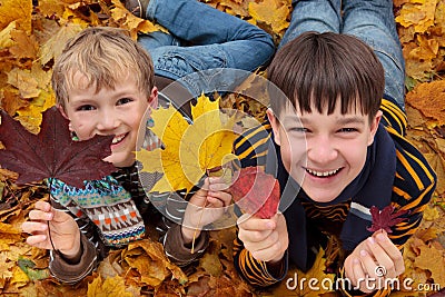 Brothers playing in Autumn Stock Photo