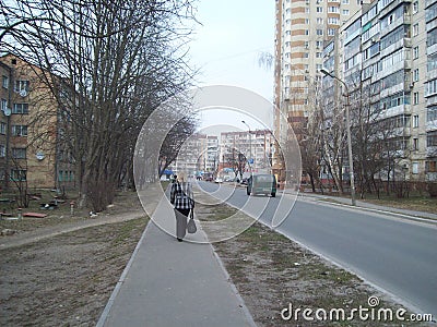 BROVARY, UKRAINE - APRIL 2, 2011. People on the streets in city Editorial Stock Photo