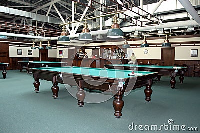 Brovary. Ukraine. 07.09.2008 The interior of the billiard room, with green tables and lamps above them Editorial Stock Photo