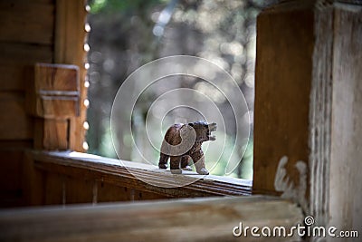 Brown bear walking in forest. Mini bear figure (or toy bear) at the park Stock Photo