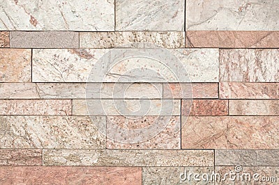 Brown or beige stone wall tiles texture. Stock Photo
