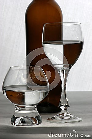 Brown bottle and glasses Stock Photo