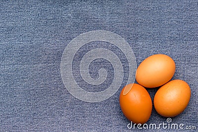 Brown chicken eggs on a blue denim Stock Photo