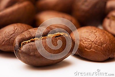 Brown coffee beans isolated on white Stock Photo