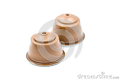 Brown coffee capsules for an automatic coffee machine isolated on white. Stock Photo