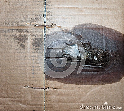 brown corrugated cardboard texture background with motor oil stain Stock Photo