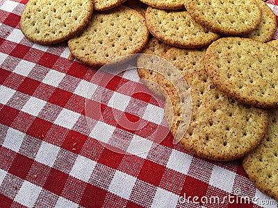 Brown crackers on a red and white checkered background Stock Photo