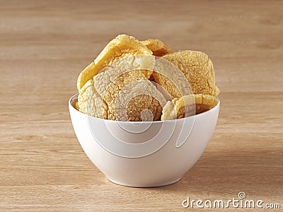 Brown crackers served in a white bowl Stock Photo