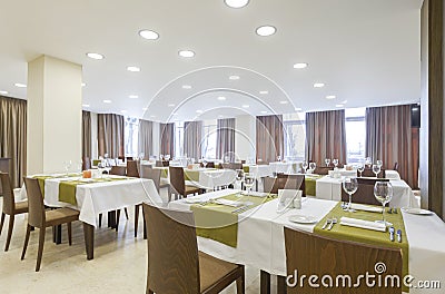 Brown curtains in restaurant with serving tables Stock Photo