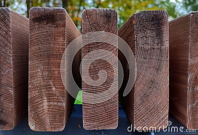 Brown ends of garden bench boards made of wood Stock Photo