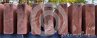 Brown ends of garden bench boards made of wood. Stock Photo