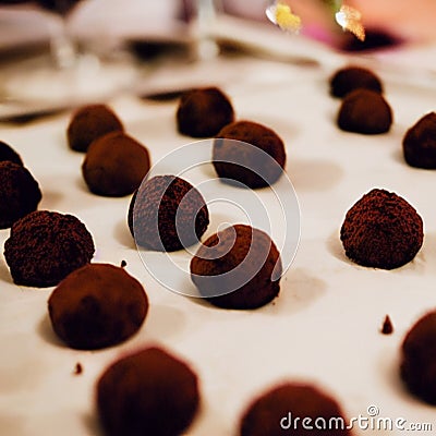 Brown filled cocoa powder truffles, praline, dessert, confectionery, cooking, food - AI generated art, Generative AI Stock Photo