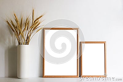 Brown flowers with brown frames over the table with natural light. Stock Photo